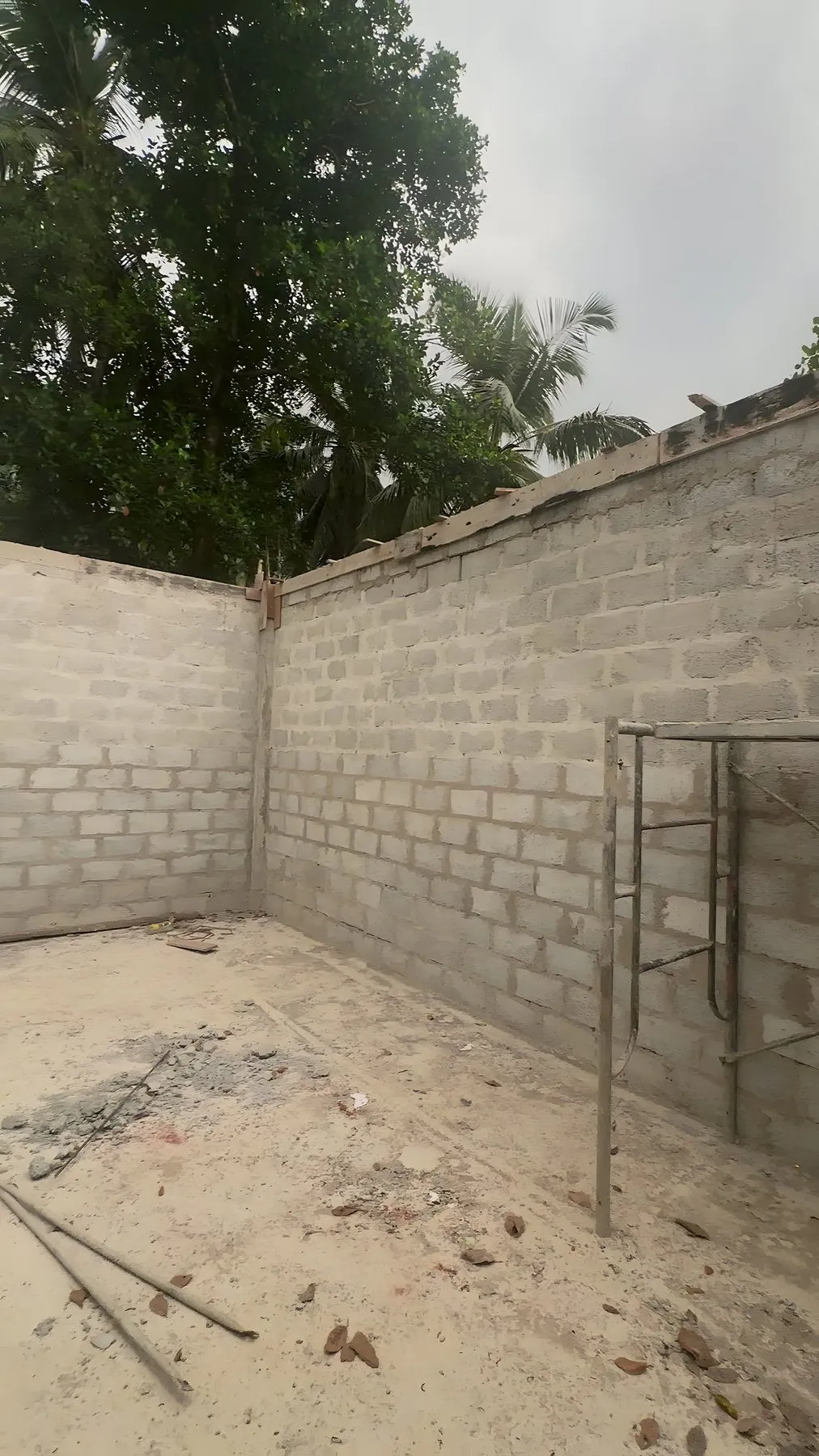 The kitchen's block walls finished, with scaffolding ready for the roof